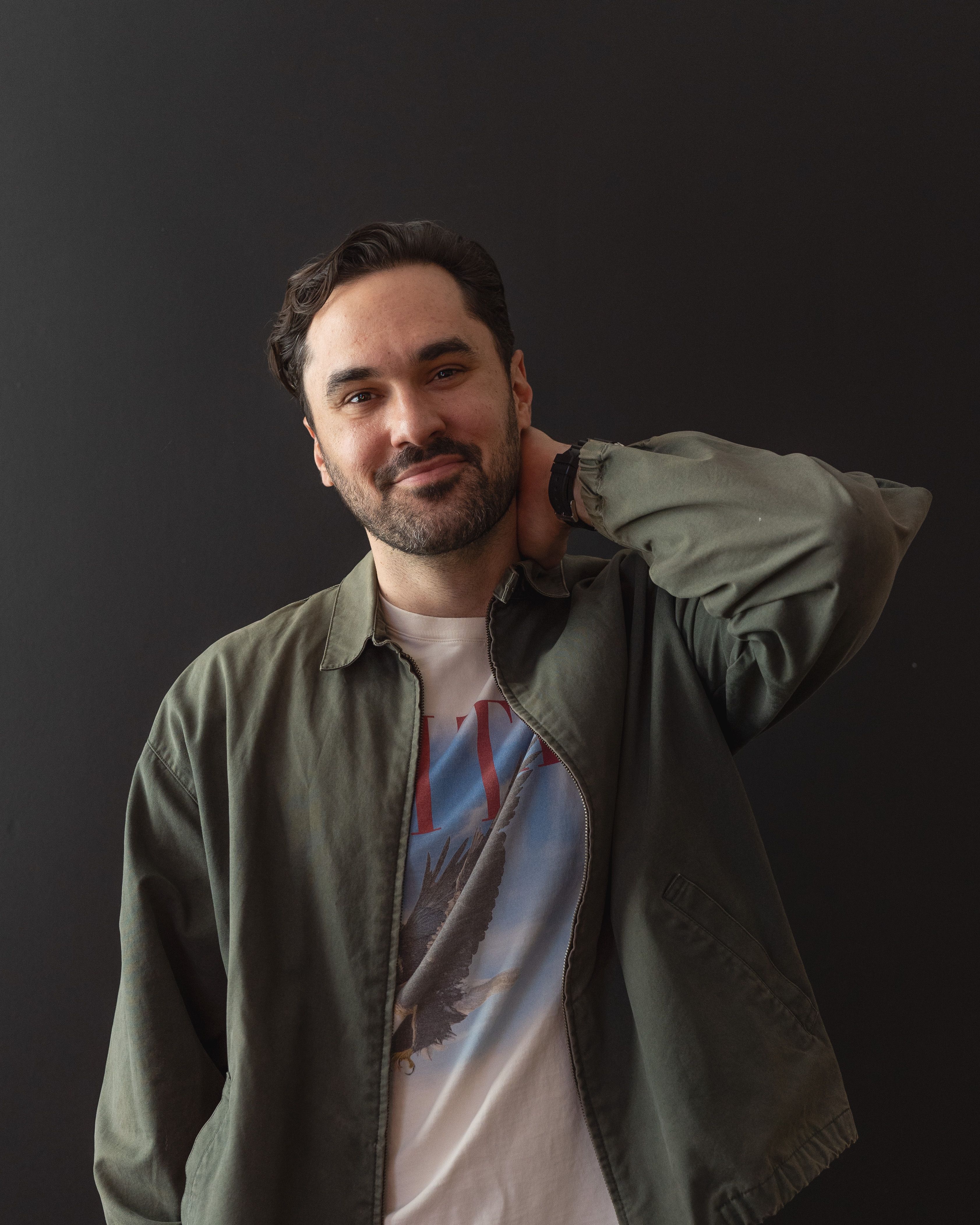 Rob Howe in an olive jacket, hand on the back of his neck